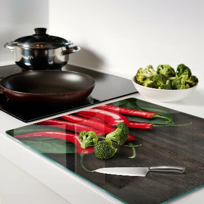 Planche à découper en verre Piments sur fond de bois