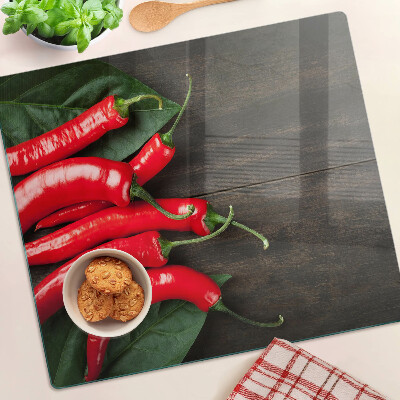 Planche à découper en verre Piments sur fond de bois