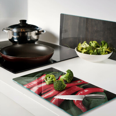 Planche à découper en verre Piments sur fond de bois