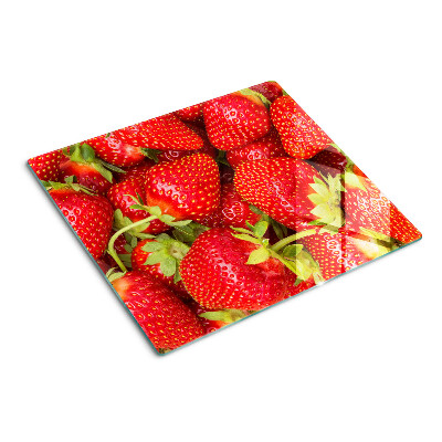 Planche à découper en verre Des fraises en arrière-plan