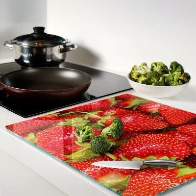 Planche à découper en verre Des fraises en arrière-plan
