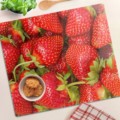 Planche à découper en verre Des fraises en arrière-plan