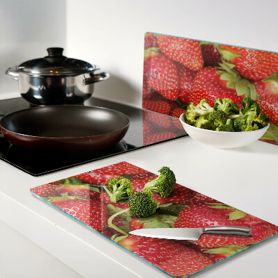 Planche à découper en verre Des fraises en arrière-plan