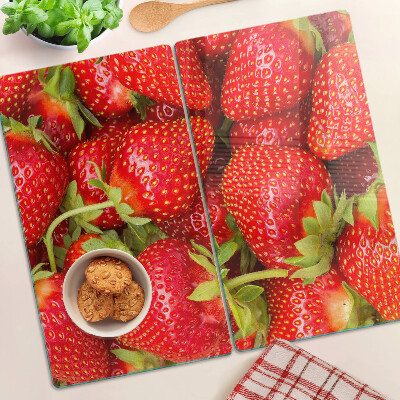 Planche à découper en verre Des fraises en arrière-plan