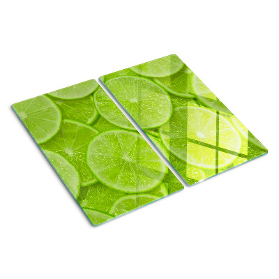 Planche à découper verre Tranches de citron vert sur fond vert