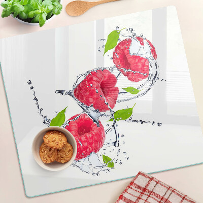 Planche à découper verre Framboises dans l'eau avec des feuilles