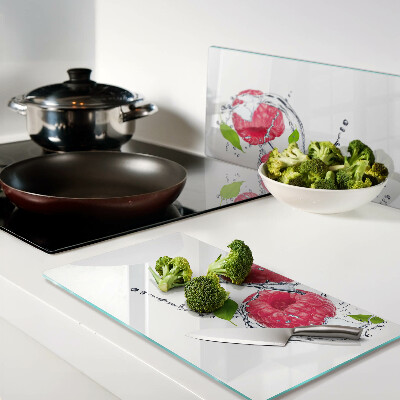 Planche à découper verre Framboises dans l'eau avec des feuilles