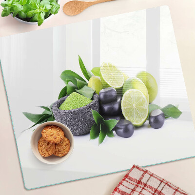 Planche à découper verre Citrons et raisins sur fond vert