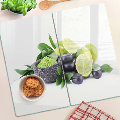 Planche à découper verre Citrons et raisins sur fond vert