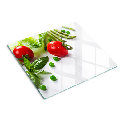 Planche à découper verre Légumes sur un comptoir blanc