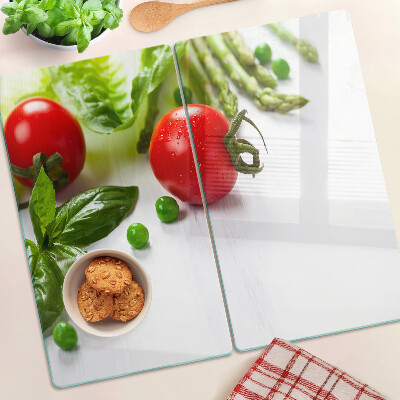 Planche à découper verre Légumes sur un comptoir blanc
