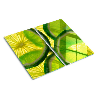 Planche à découper en verre Tranches de citron vert sur fond vert