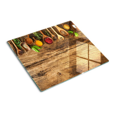 Planche à découper en verre Épices et herbes sur fond de bois