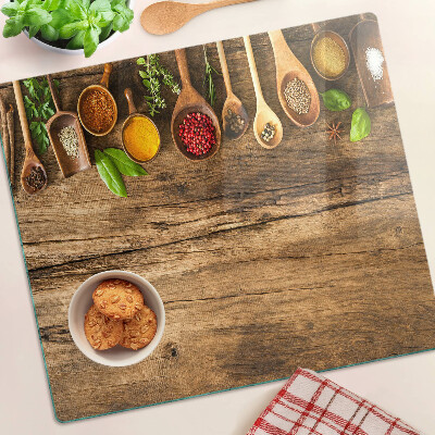Planche à découper en verre Épices et herbes sur fond de bois