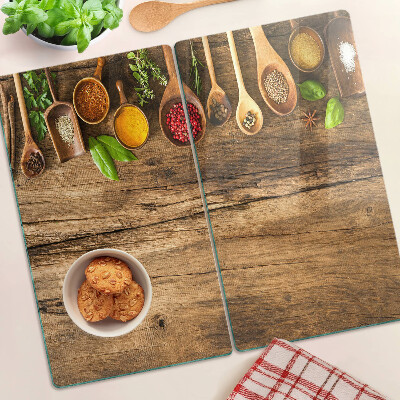 Planche à découper en verre Épices et herbes sur fond de bois