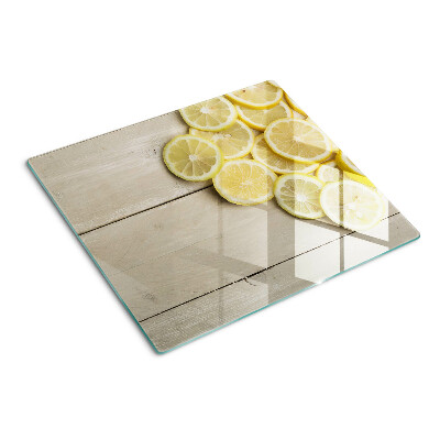 Planche à découper verre Tranches de citron sur fond de bois