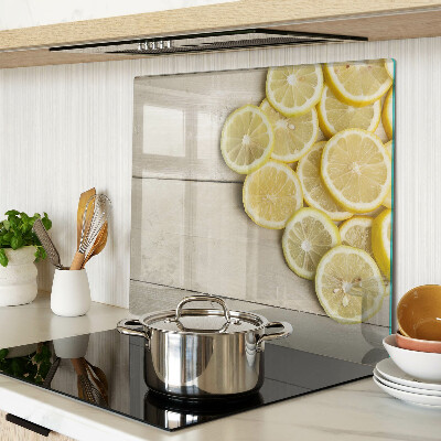 Planche à découper verre Tranches de citron sur fond de bois
