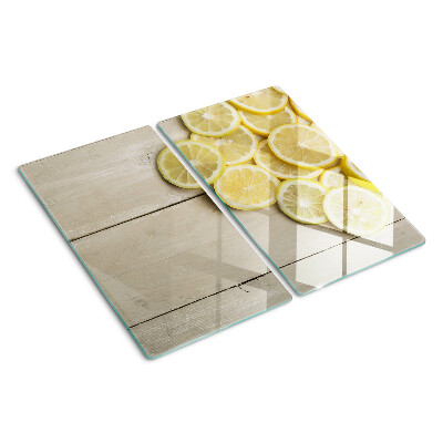 Planche à découper verre Tranches de citron sur fond de bois