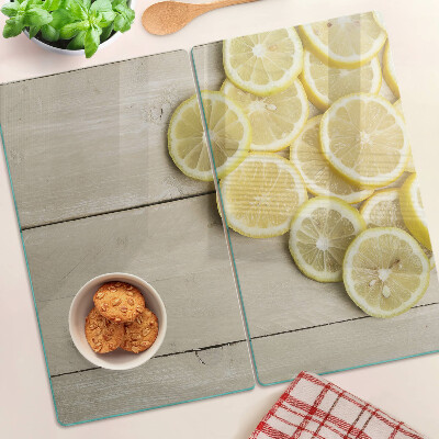 Planche à découper verre Tranches de citron sur fond de bois