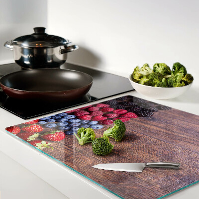 Planche à découper verre Fruits des bois sur fond de bois