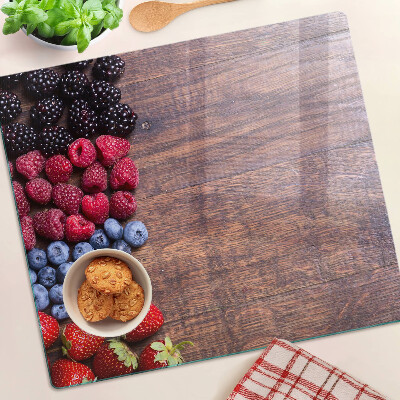 Planche à découper verre Fruits des bois sur fond de bois