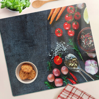Planche à découper en verre Légumes et épices sur fond sombre