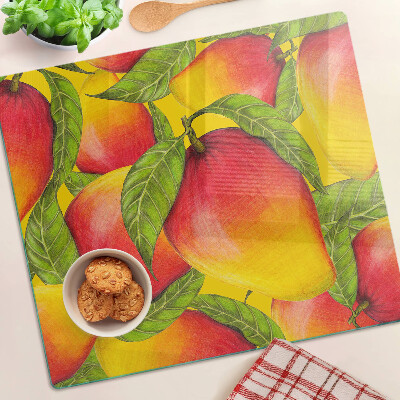 Planche à découper verre Poivrons sur fond de feuilles vertes