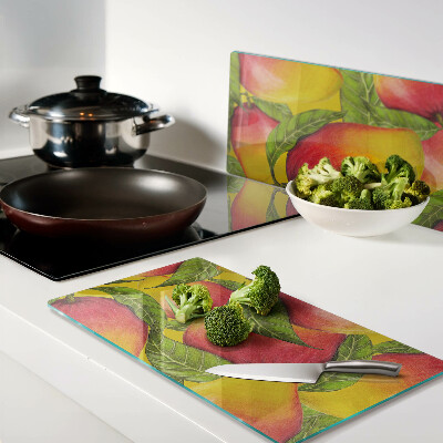 Planche à découper verre Poivrons sur fond de feuilles vertes
