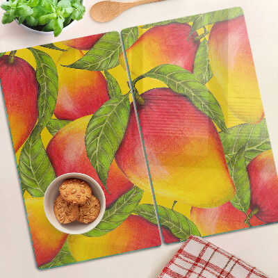 Planche à découper verre Poivrons sur fond de feuilles vertes