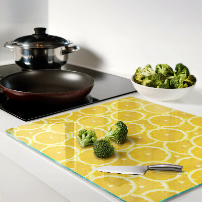 Planche à découper en verre Tranches de citron sur fond jaune