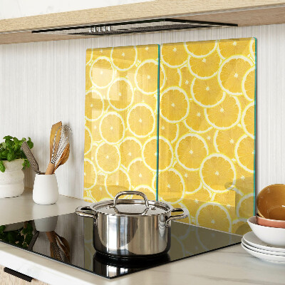 Planche à découper en verre Tranches de citron sur fond jaune