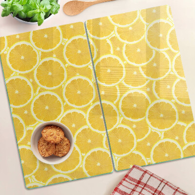 Planche à découper en verre Tranches de citron sur fond jaune
