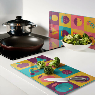 Planche à découper en verre Motif de fruits dans des carrés colorés