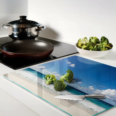 Planche à découper en verre Plage avec eau turquoise et nuages