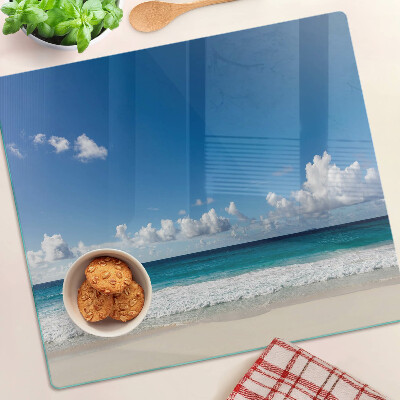 Planche à découper en verre Plage avec eau turquoise et nuages