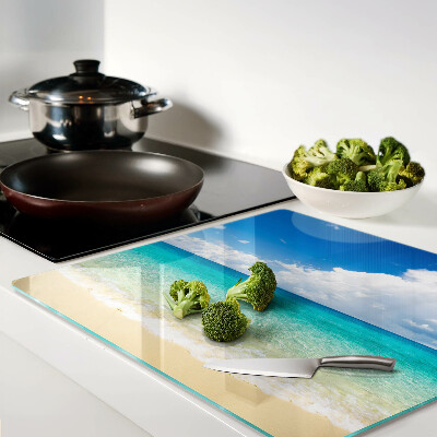 Planche à découper verre Plage avec eau turquoise et nuages