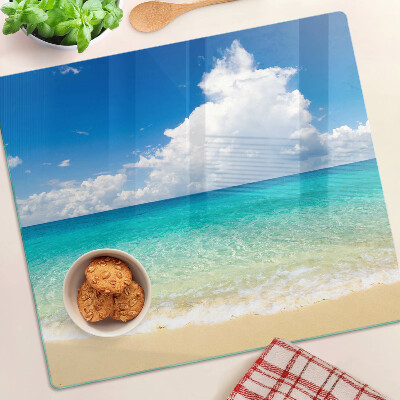 Planche à découper verre Plage avec eau turquoise et nuages