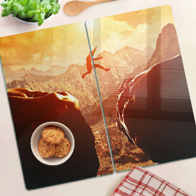 Planche à découper en verre Sauter dans les montagnes au coucher du soleil