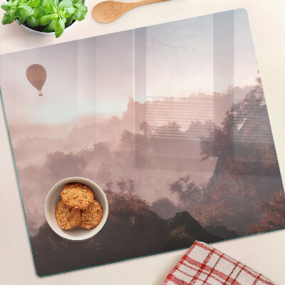 Planche à découper verre Montgolfière au-dessus du paysage