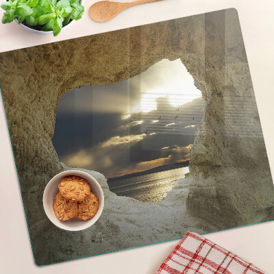 Planche à découper verre Vue sur la mer à travers la grotte