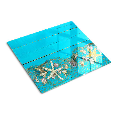 Planche à découper verre Coquillages et étoiles de mer dans un filet