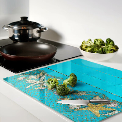 Planche à découper verre Coquillages et étoiles de mer dans un filet