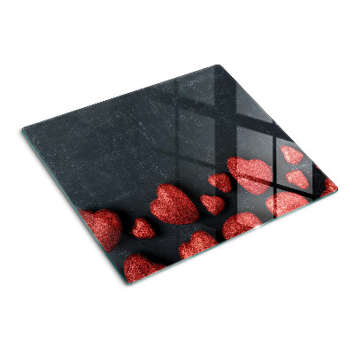 Planche à découper en verre Coeurs rouges sur fond sombre