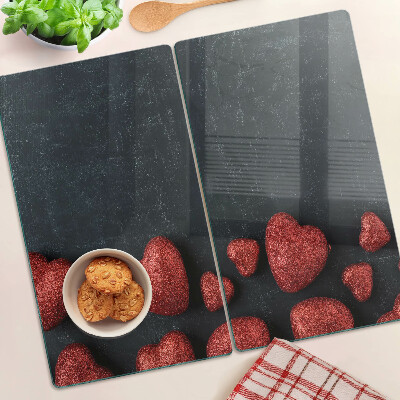 Planche à découper en verre Coeurs rouges sur fond sombre