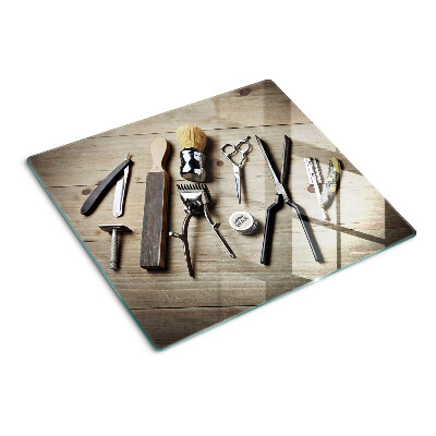 Planche à découper en verre Outils de coiffure sur fond de bois