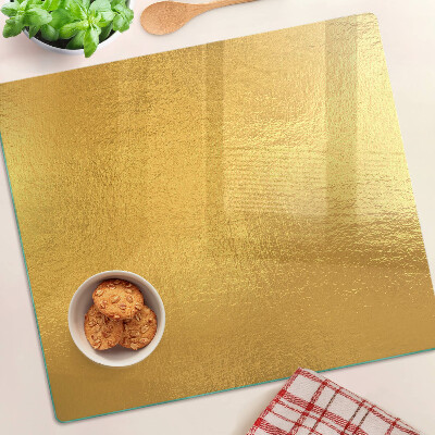 Planche à découper verre Surface dorée avec reflets