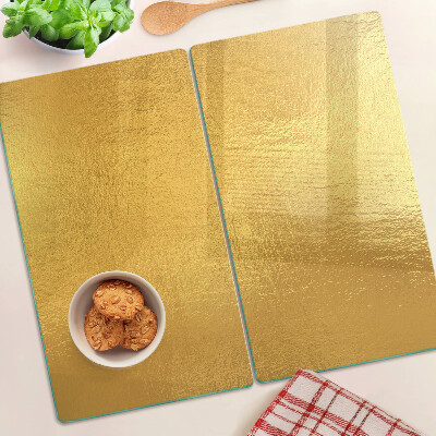 Planche à découper verre Surface dorée avec reflets