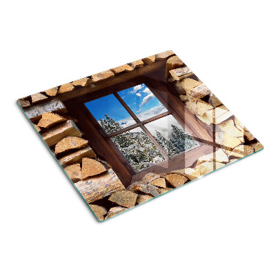 Planche à découper verre Vue d'un paysage d'hiver à travers la fenêtre