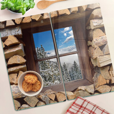 Planche à découper verre Vue d'un paysage d'hiver à travers la fenêtre