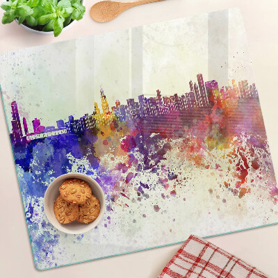 Planche à découper en verre Panorama de la ville en taches colorées